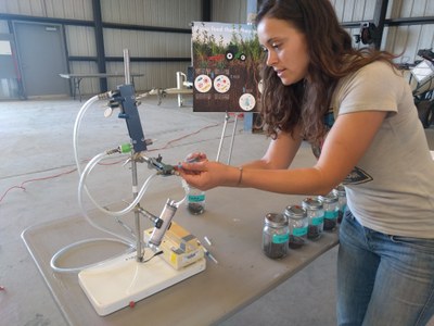 PhD student Jessica Chiartas demonstrates how carbon sequestration differs in different soil types