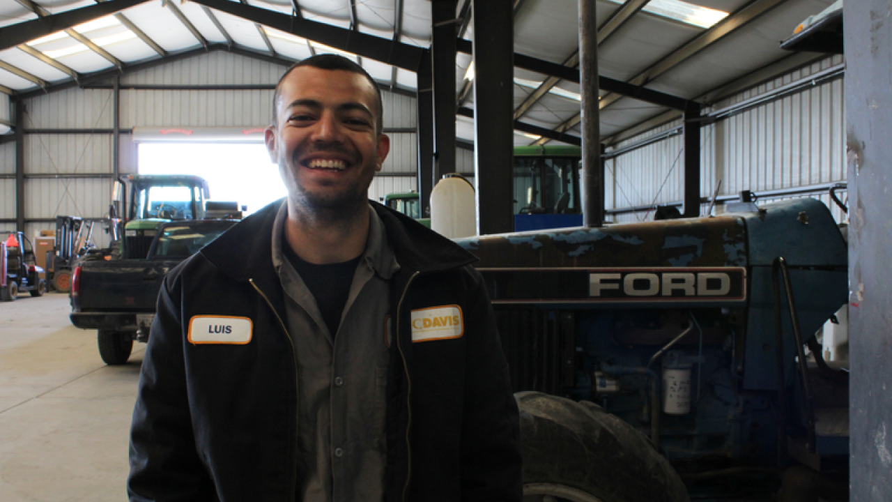 Luis Loza Reyes in the barn at Russell Ranch's Sustainable Agriculture Facility