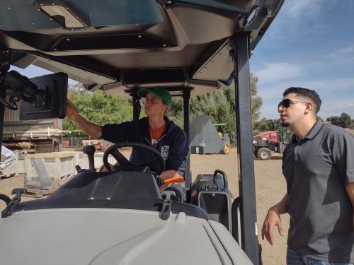 Jan Velilla checking settings on the new Monarch Electric Tractor