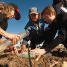 Russell Ranch director Kate Scow works with students to collect soil samples for testing. Photo from UC Davis Science and Climate website.